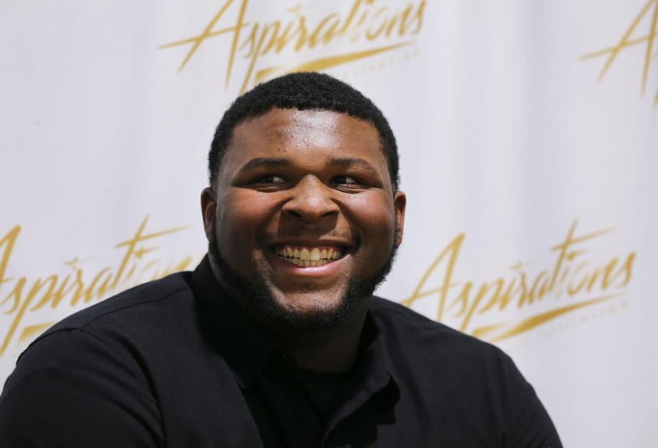 Five-star offensive tackle Kiyaunta Goodwin was all smiles after he made the decision to play football at Kentucky instead of Michigan State during a signing ceremony at the Aspirations gym in Louisville, Ky. on Dec. 15, 2021.  