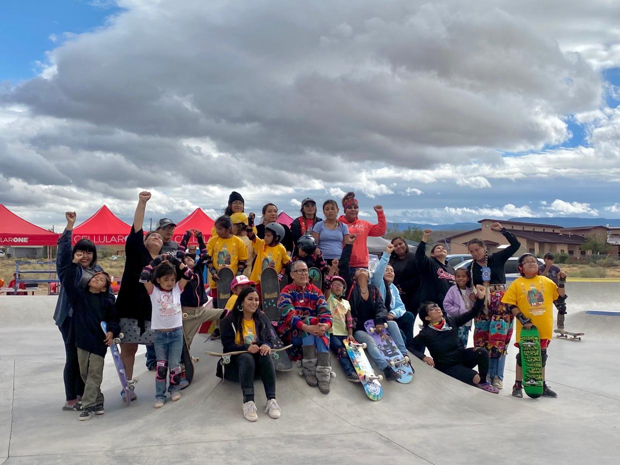 Amy Denet Deal, founder of 4Kinship, was the driving force behind the crowdfunding and planning of the Two Grey Hills Skatepark. She sits in the middle of some of the young skaters who participated in the Modern Matriarchs Skate Jam competition, Sept. 23, 2023.