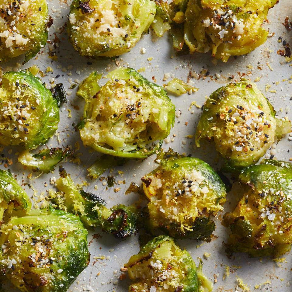 <p>Brussels sprouts get crispy and flavorful in the oven when they're "smashed" and seasoned with Parmesan cheese and everything bagel seasoning. <a href="https://www.eatingwell.com/recipe/7887813/crispy-smashed-brussels-sprouts/" rel="nofollow noopener" target="_blank" data-ylk="slk:View Recipe;elm:context_link;itc:0;sec:content-canvas" class="link ">View Recipe</a></p>