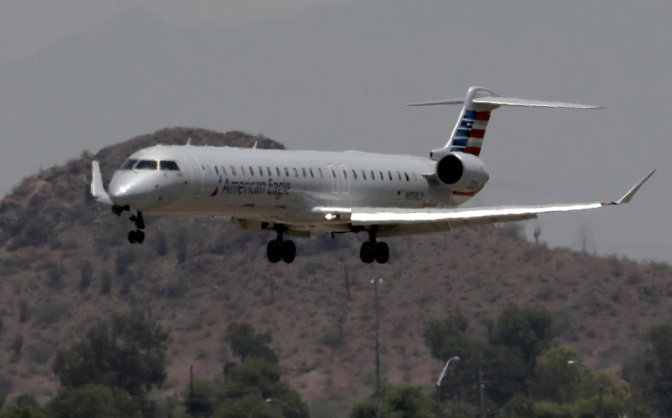 <p>An American Eagle jet is seen through heat ripples as it lands at Sky Harbor International Airport, June 19, 2017,in Phoenix. (Matt York/AP) </p>