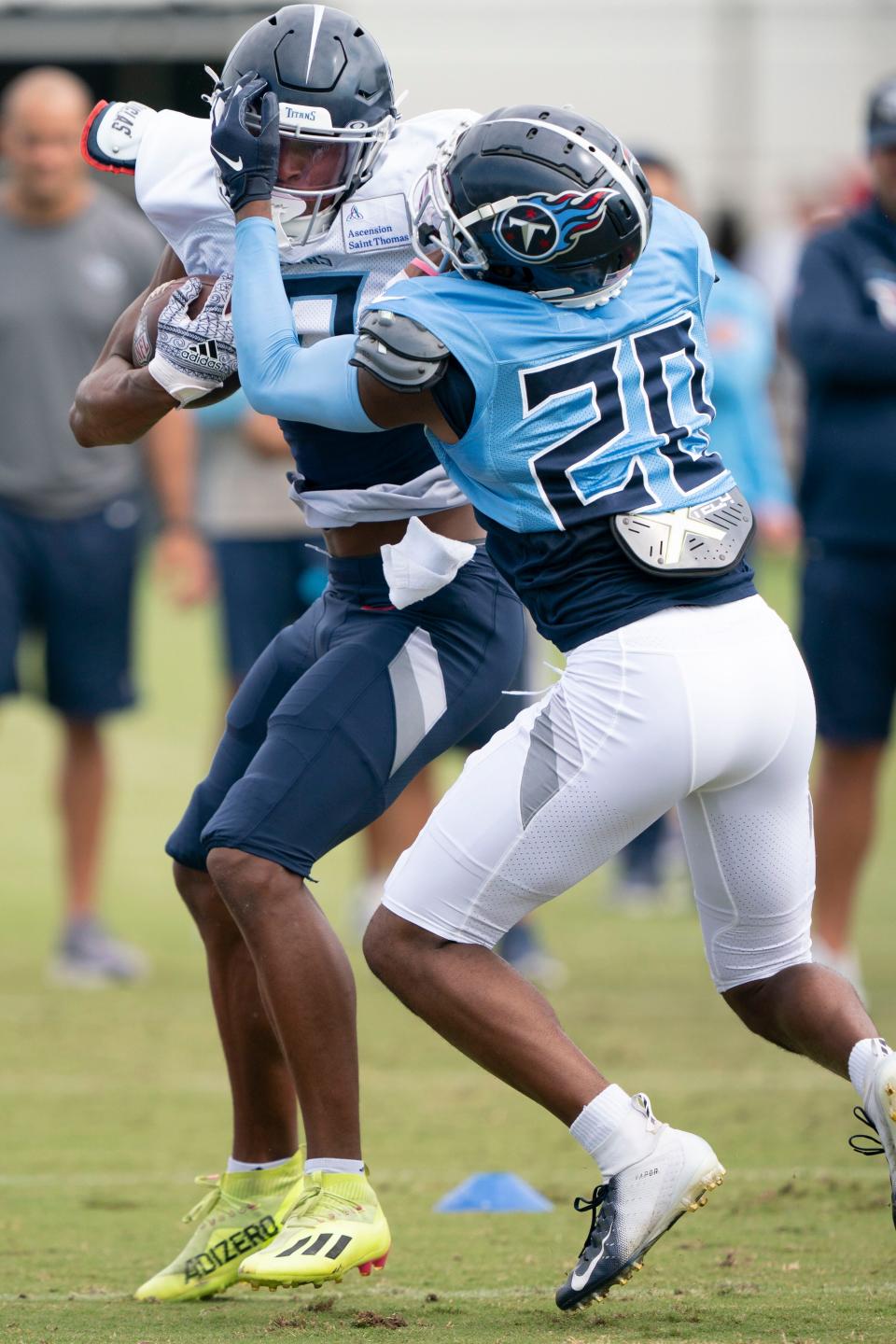 Tennessee Titans wide receiver Dez Fitzpatrick (10) tries to get past cornerback Tre Swilling (20) during a training camp practice at Ascension Saint Thomas Sports Park Tuesday, Aug. 2, 2022, in Nashville, Tenn. 