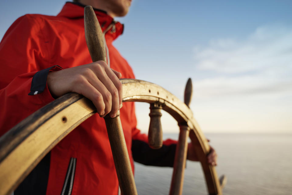 A man steering a ship