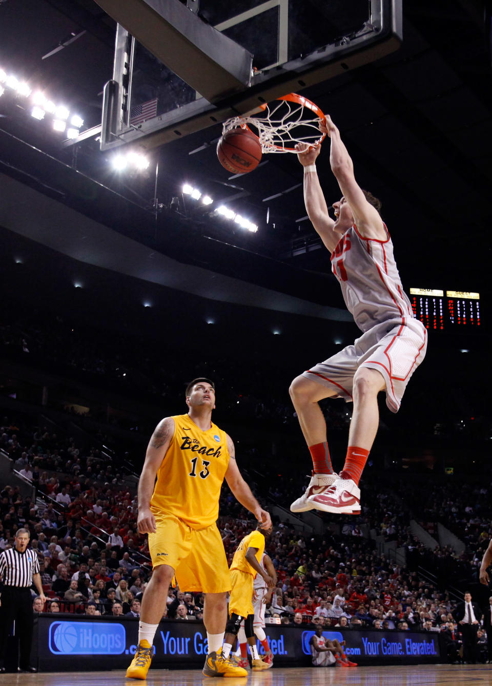 PORTLAND, OR - MARCH 15: Cameron Bairstow #41 of the New Mexico Lobos dunks the ball as Edis Dervisevic #13 of the Long Beach State 49ers looks on in the first half in the second round of the 2012 NCAA men's basketball tournament at Rose Garden Arena on March 15, 2012 in Portland, Oregon. (Photo by Jonathan Ferrey/Getty Images)