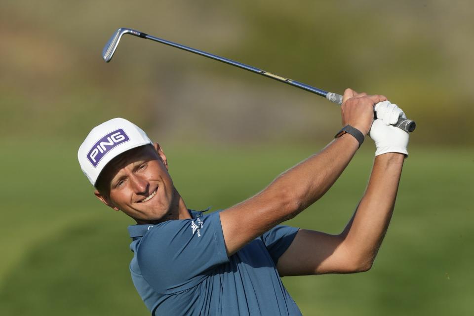 Adrian Meronk of Poland plays his second shot on 14th hole during the second round of the Hero Dubai Desert Classic golf tournament, in Dubai, United Arab Emirates, Friday, Jan. 19, 2024. (AP Photo/Kamran Jebreili)