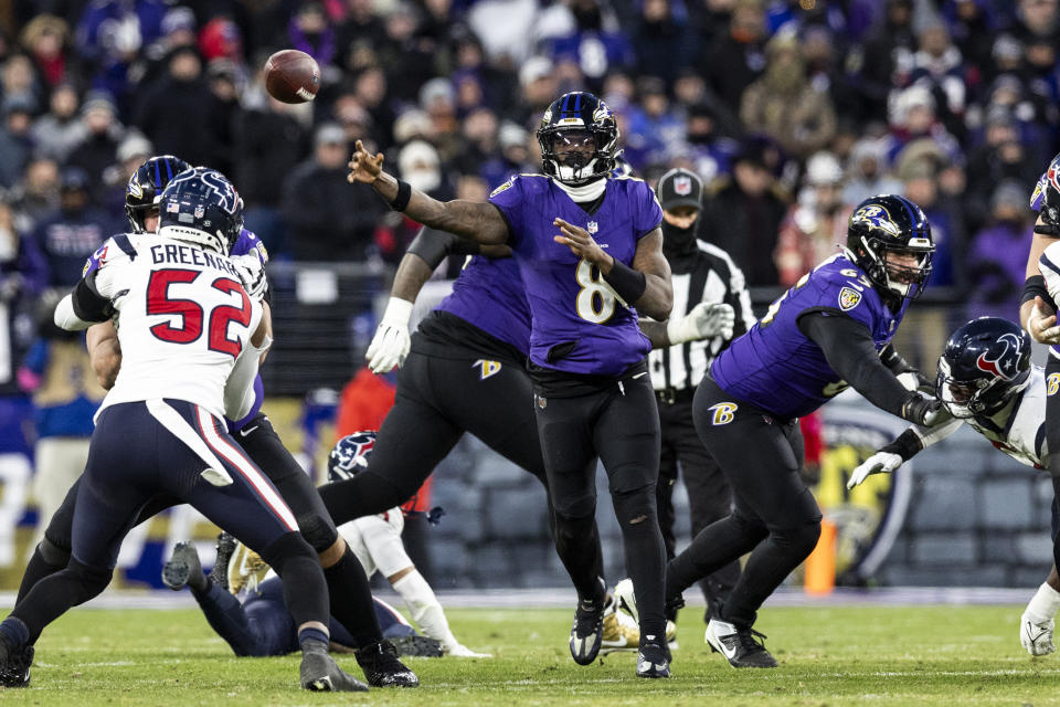 BALTIMORE, MARYLAND - JANUARY 20: Lamar Jackson #8 of the Baltimore Ravens throws a pass during the game against the Houston Texans at M&T Bank Stadium on January 20, 2024 in Baltimore, Maryland. The Ravens beat the Texans 34-10. (Photo by Lauren Leigh Bacho/Getty Images)