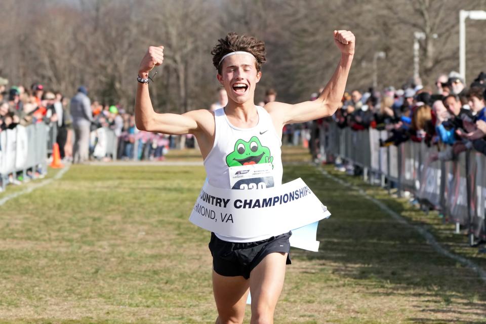 Newbury Park High senior Leo Young celebrates after winning the men's Under-20 race at the USA Cross Country Championships in 23:46.8 on Saturday in Richmond, Virginia.