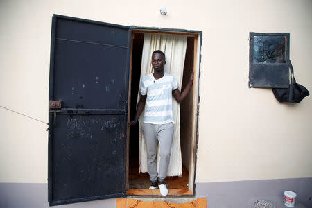 Buba Fubareh, a Gambian migrant who voluntarily returned from Libya, stands at his home in Brikama, Gambia April 6, 2017. REUTERS/Luc Gnago