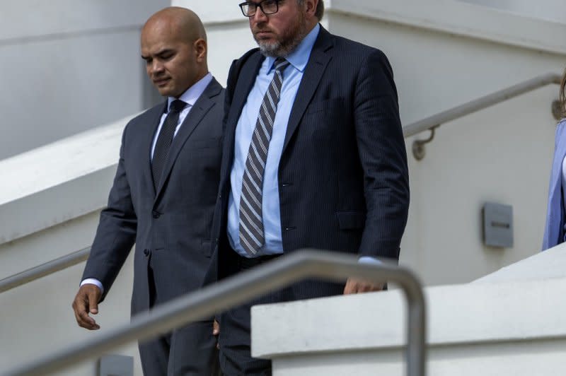 Walt Nauta (L), aid to former U.S. President Donald Trump and indicated in the classified documents case, is seen leaving Florida's Alto Lee Adams, Sr United States federal courthouse in Aug. 2023 in Fort Pierce. The government alleges that Nauta had helped move classified documents, and that along with Mar-a-Lago maintenance worker Carlos De Oliveira allegedly conspired to try to delete video surveillance footage. File Photo by Gary Rothstein/UPI