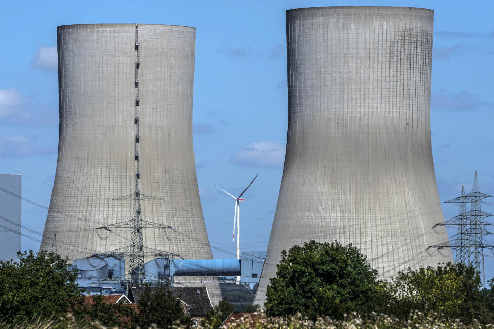 FILE - A wind turbine is seen behind the shut down coal-fired power plant Westfalen of RWE Generation SE is seen in Hamm, Germany, on Aug. 10, 2023. (AP Photo/Martin Meissner, File)