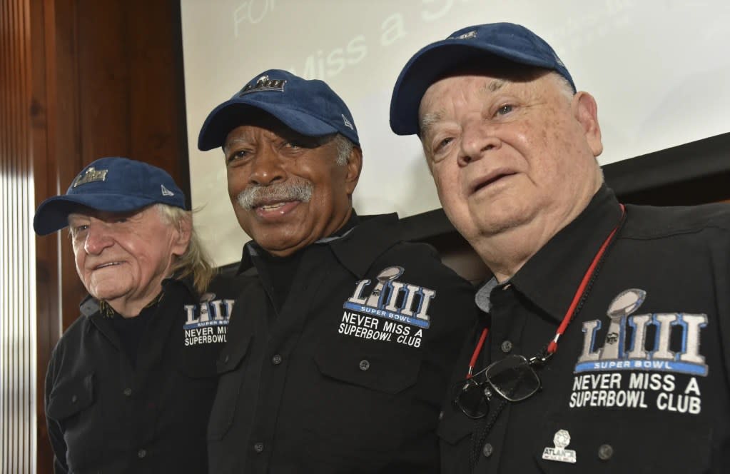 Members of the Never Miss a Super Bowl Club, from the left, Tom Henschel, Gregory Eaton, and Don Crisman pose for a group photograph during a welcome luncheon, in Atlanta, Friday, Feb. 1, 2019. (Hyosub Shin/Atlanta Journal-Constitution via AP, File)