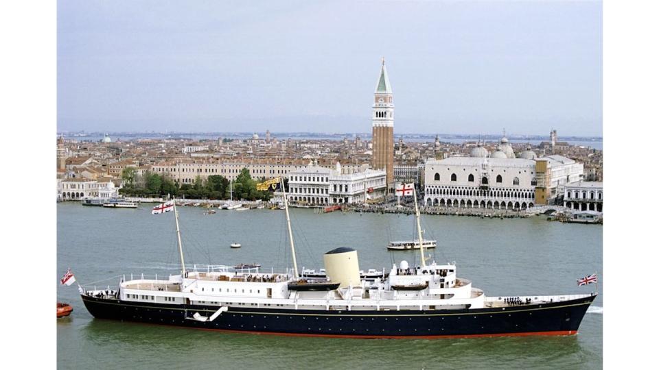 The Royal Yacht Britannia sailing through Venice