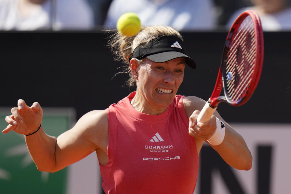 Germany's Angelique Kerber returns the ball Poland's Iga Swiatek at the Italian Open tennis tournament in Rome, Monday, May 13, 2024. (AP Photo/Alessandra Tarantino)