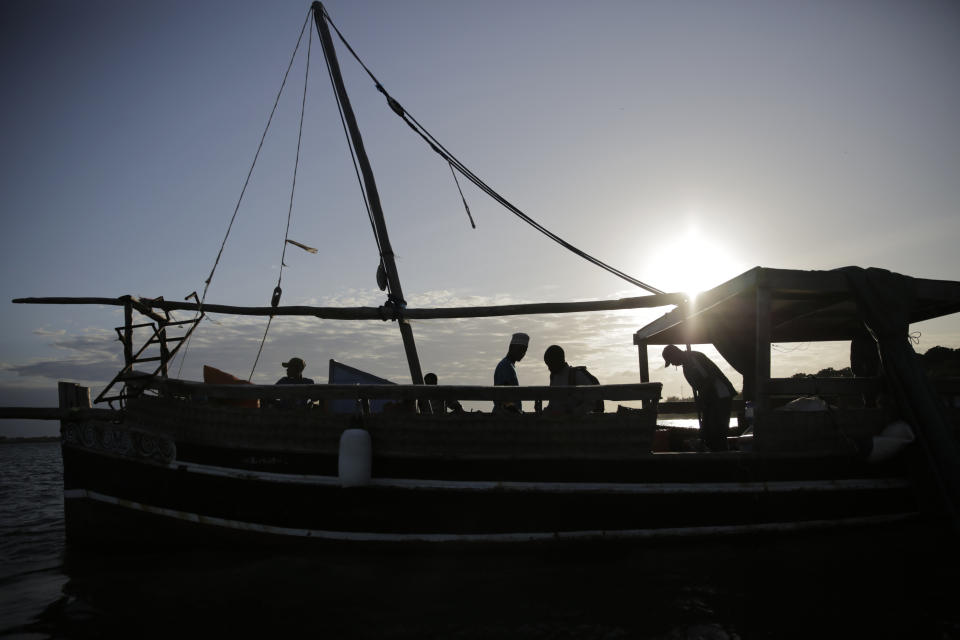 Fishermen at Shimoni port prepare to head out for their daily catch on Friday, June 10, 2022, in Kwale county, Kenya. Artisanal fisheries on Kenya's coast say climate change, overfishing by large foreign vessels and a lack of other job opportunities for coastal communities is draining the Indian Ocean of its yellowfin tuna stocks. (AP Photo/Brian Inganga)