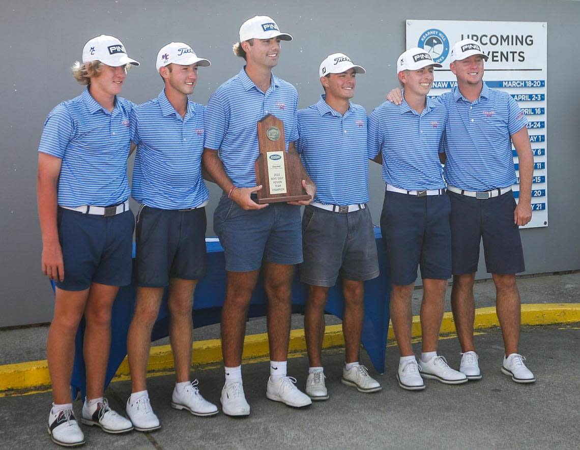 The Madison Central boys’ golf team poses with the first-place trophy after winning the Region 9 title at Kearney Hill Golf Links in Lexington on Wednesday.