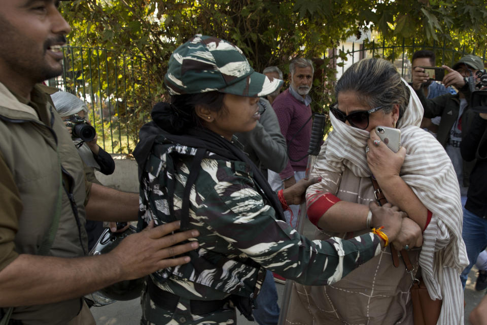 Indian paramilitary women detain a Kashmiri woman who was among those protesting against Indian government downgrading the region's semi-autonomy in Srinagar, Indian controlled Kashmir, Tuesday, Oct. 15, 2019. A small group of women under the banner of ‘Women of Kashmir’, a civil society group had gathered for a peaceful protest demanding restoration of civil liberties and fundamental rights of citizens. (AP Photo/Dar Yasin)