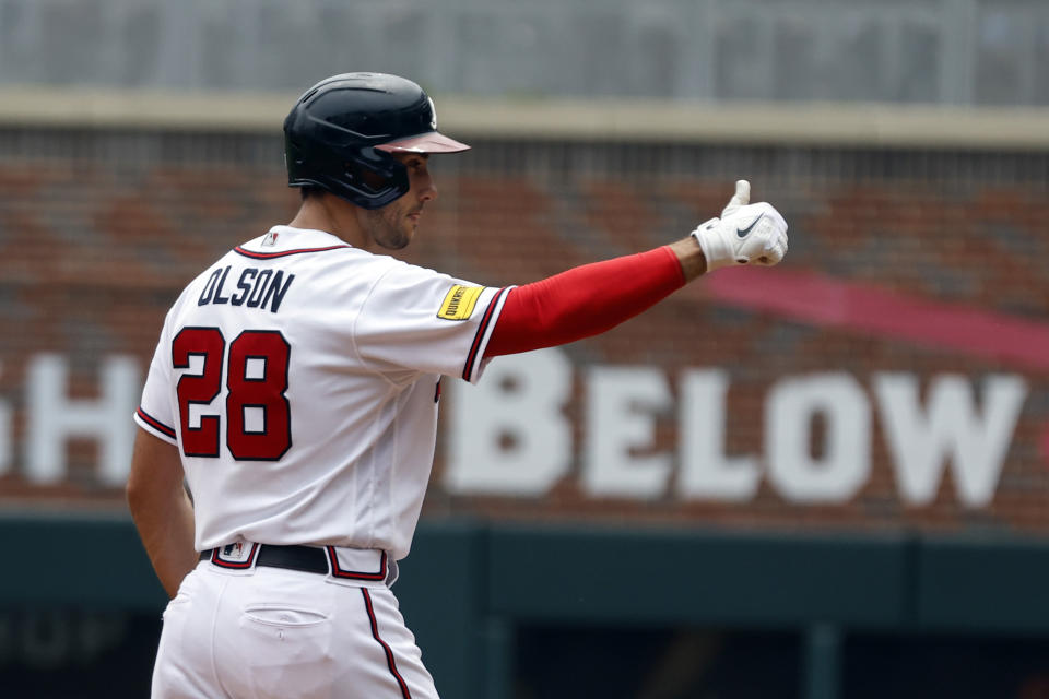 Atlanta Braves' Matt Olson reacts after hitting a double in the third inning of a baseball game against the Colorado Rockies, Sunday, June 18, 2023, in Atlanta. (AP Photo/Butch Dill)