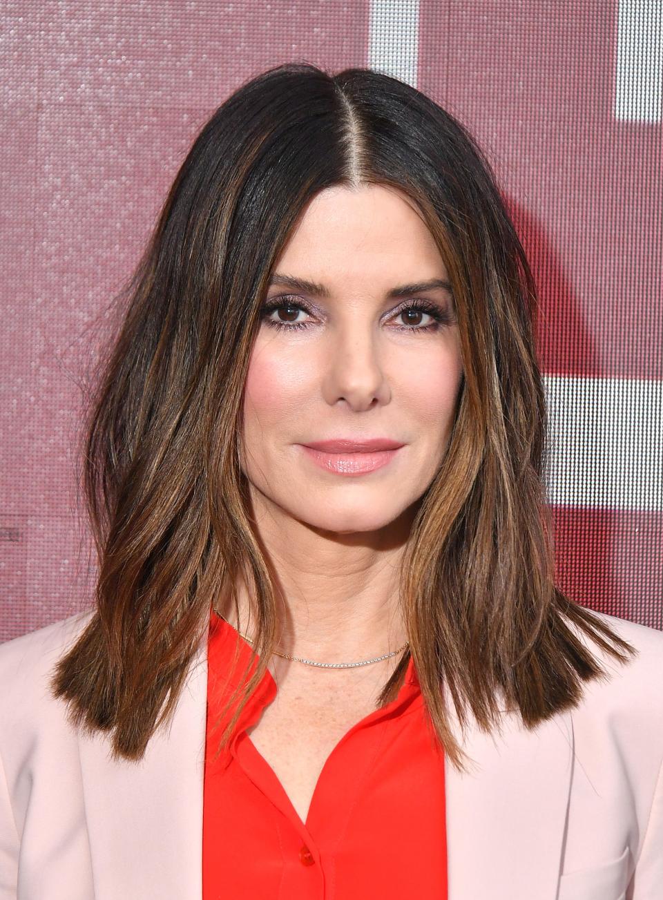 Sandra Bullock was a surprise guest on a 'Red Table Talk' episode honoring 'hero mothers' on the frontline against coronavirus.