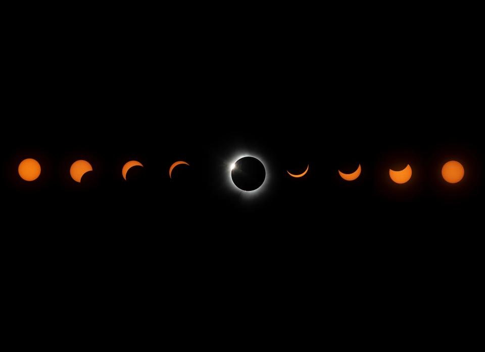 The progression of the total solar eclipse is shown in this composite image of nine photos taken between 12:45 p.m. and 3:20 p.m. on Monday, April 8, 2024, photographed from downtown Evansville, Indiana.