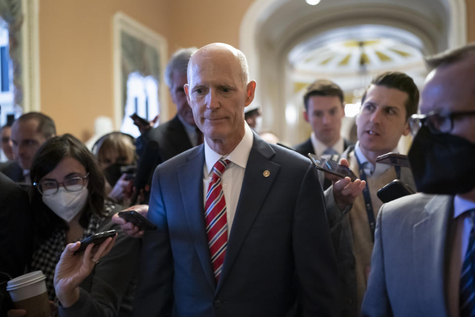 Sen. Rick Scott, R-Fla., who led the Senate Republican campaign arm this year, is surrounded by reporters as he arrives at the historic Old Senate Chamber where he is mounting a long-shot bid to unseat Senate Republican leader Mitch McConnell, at the Capitol in Washington, Wednesday, Nov. 16, 2022. (AP Photo/J. Scott Applewhite)