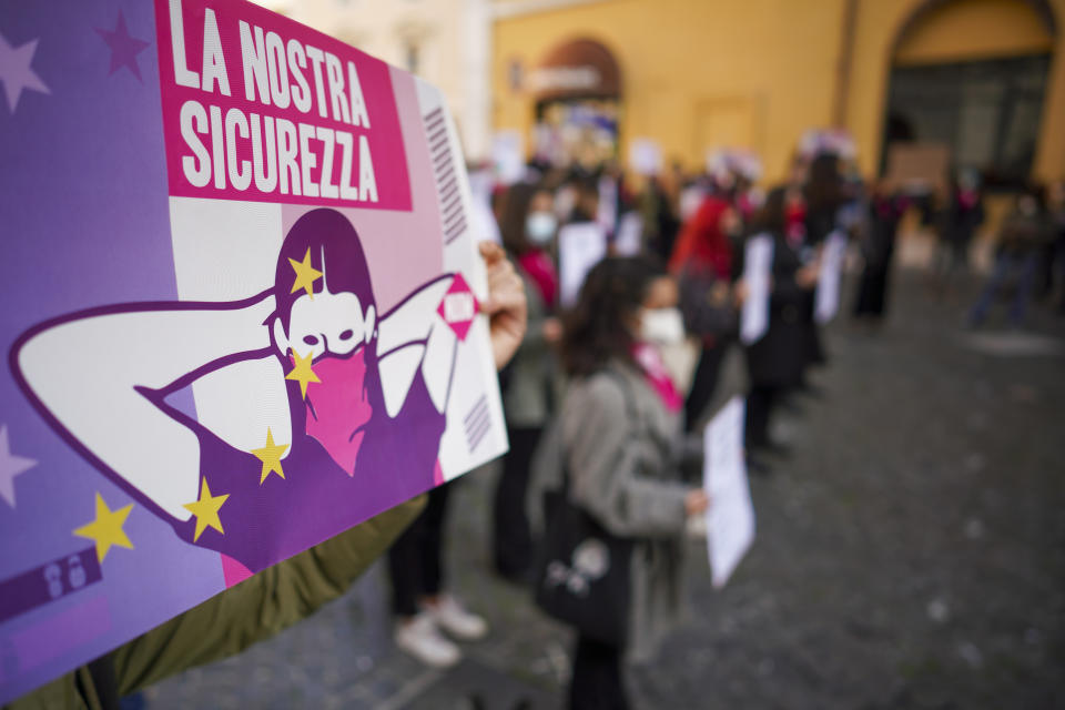 Women take part in a demonstration on the International Day for the Elimination of Violence against Women, in Rome, Wednesday, Nov. 25, 2020. (AP Photo/Andrew Medichini)