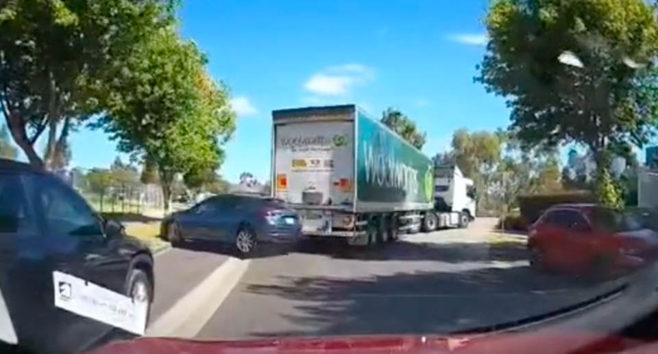 The rear of the Woolworths truck hit the Mazda 2 parked on the side of the road outside the Woolworths Laurimar store. 