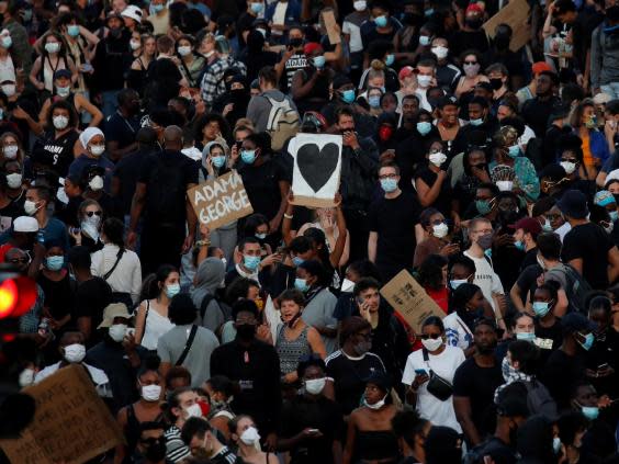 People attend a banned demonstration planned in memory of Adama Traore, France 2 June, 2020 (Reuters)