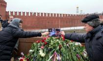 Russian mourners place a picture of Boris Nemtsov on the spot where the opposition leader was shot dead near St Basil's Cathedral in Moscow, on February 28, 2015