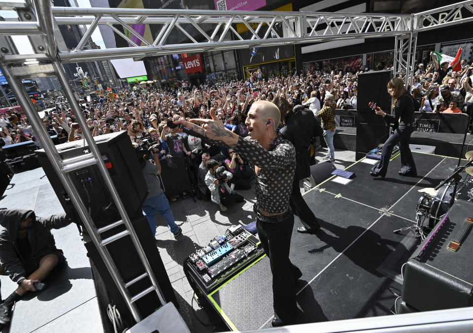 Damiano David, left, Thomas Raggi and Victoria De Angelis from the Italian rock band Måneskin perform in Times Square on Friday, Sept. 15, 2023, in New York. (Photo by Evan Agostini/Invision/AP)