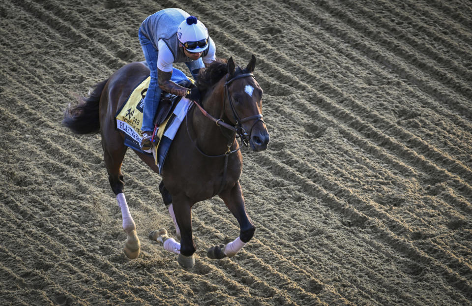 Preakness contender Blazing Sevens runs on the Pimlico track Tuesday morning, May 16, 2023, in Baltimore, in preparation for Saturday's Preakness Stakes horse race. (Jerry Jackson/The Baltimore Sun via AP)