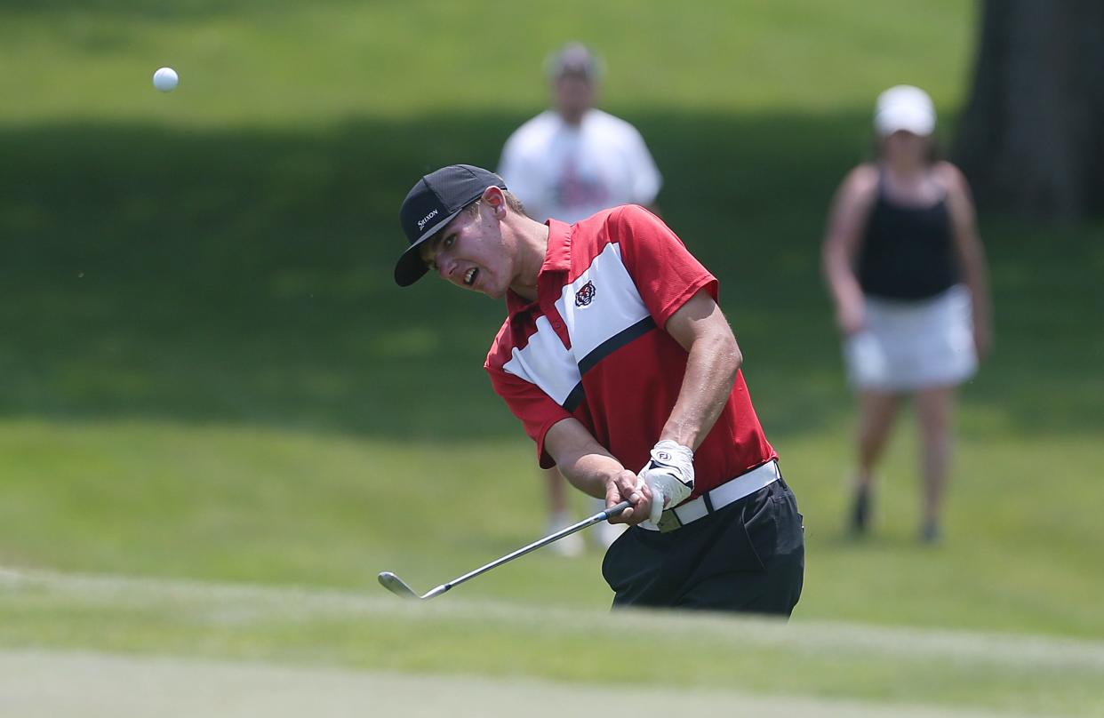 ADM's Grant Jansen looks at the ball after a chip onto the 18th hole in the class 3A boys' state golf championship at Veenker Golf Course Tuesday, May 23, 2023, in Ames, Iowa.