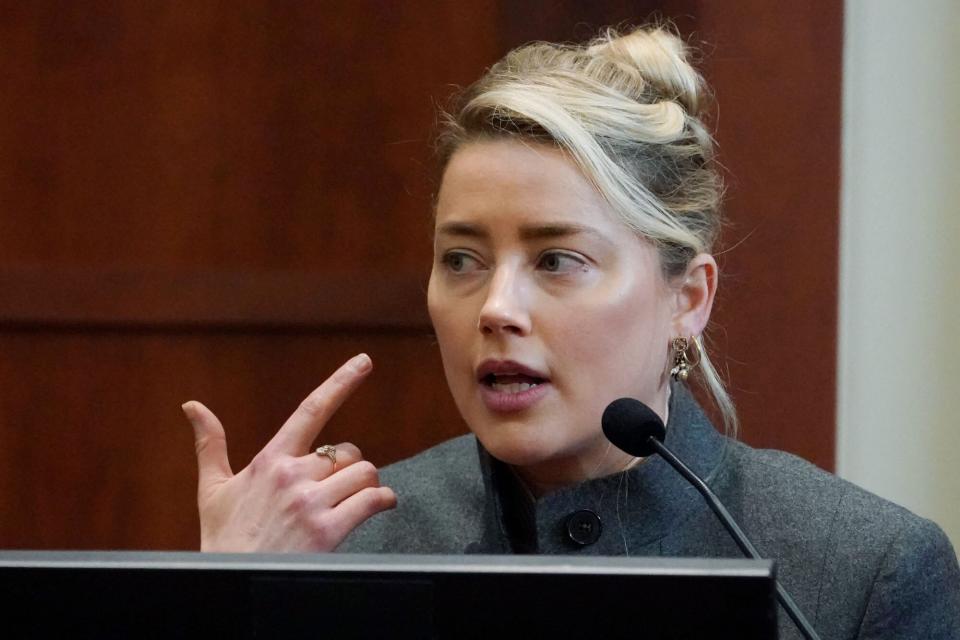 Actor Amber Heard testifies in the courtroom at the Fairfax County Circuit Courthouse in Fairfax, Virginia, on May 16, 2022. - Actor Johnny Depp sued his ex-wife Amber Heard for libel in Fairfax County Circuit Court after she wrote an op-ed piece in The Washington Post in 2018 referring to herself as a "public figure representing domestic abuse." (Photo by Steve Helber / POOL / AFP) (Photo by STEVE HELBER/POOL/AFP via Getty Images)