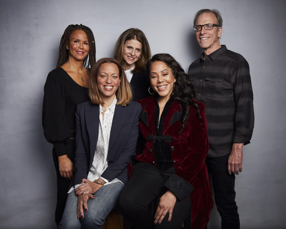 FILE - In this Jan. 26, 2020 file photo, Sil Lai Abrams, back row from left, director Amy Ziering, director Kirby Dick, Drew Dixon, seated left, and Sheri Hines pose for a portrait to promote the film "On the Record" at the Music Lodge during the Sundance Film Festival in Park City, Utah. The film provides an intimate portrayal of the agonizing process of calculating whether to go public with harassment and abuse claims. (Photo by Taylor Jewell/Invision/AP, File)
