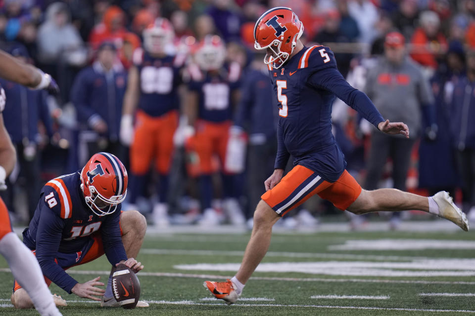 Illinois place-kicker Caleb Griffin, right, boots a field goal during the first half of an NCAA college football game against Northwestern, Saturday, Nov. 25, 2023, in Champaign, Ill. (AP Photo/Erin Hooley)