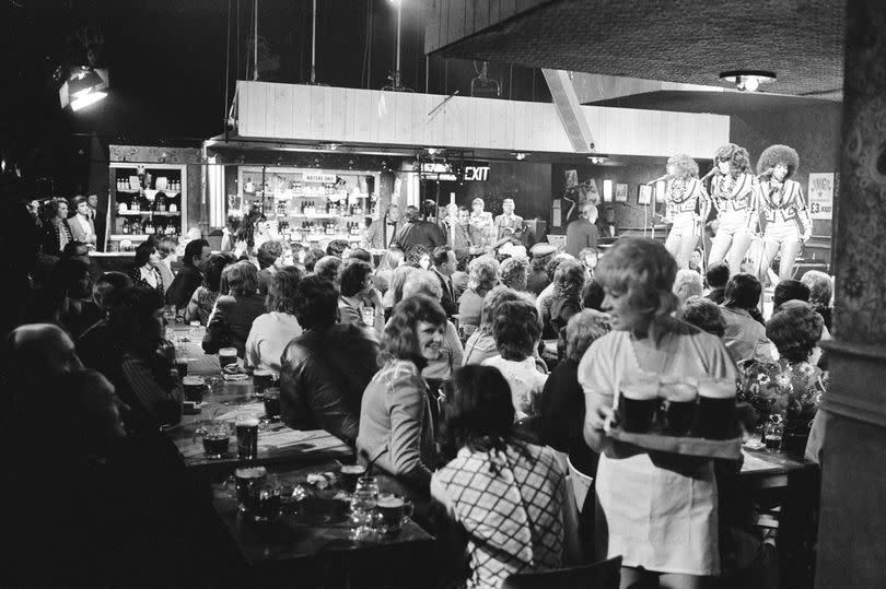 Waitresses would often walk in front of the cameras while serving audience members