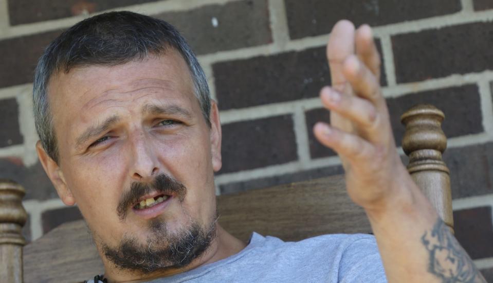 Jamie White talks to the media in the front yard of his home on Grier Street Monday morning, April 24, 2023, about taking a bullet for his daughter.