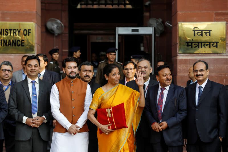 India's Finance Minister Nirmala Sitharaman holds budget papers as she leaves her office to present the federal budget in the parliament in New Delhi