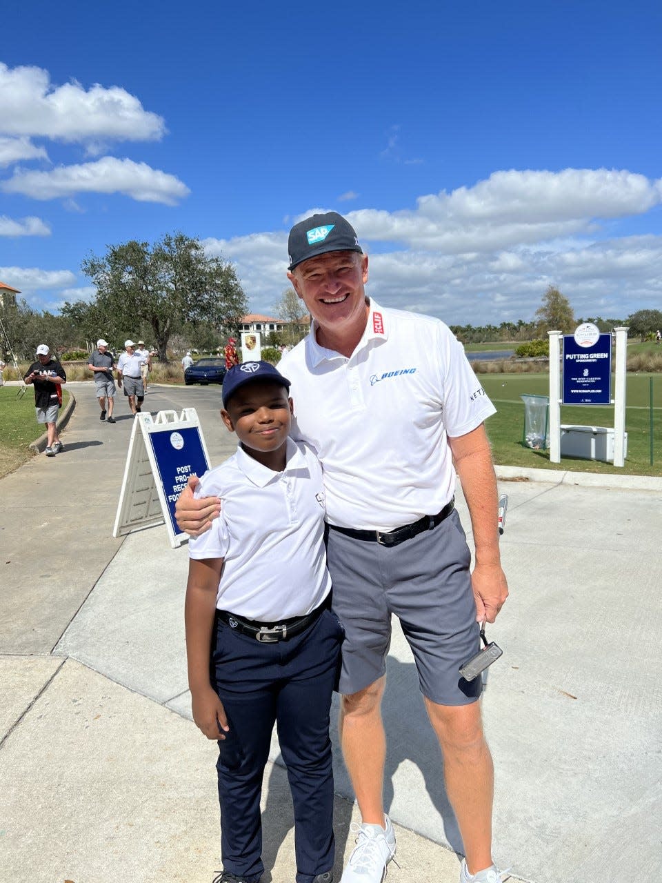 In a recent photo, Ernie Els is seen with Carter Bonas, a young man who is on the autism spectrum. Bonas started his own golf clothing company, Spectrum Golf, two years after having suicidal thoughts.