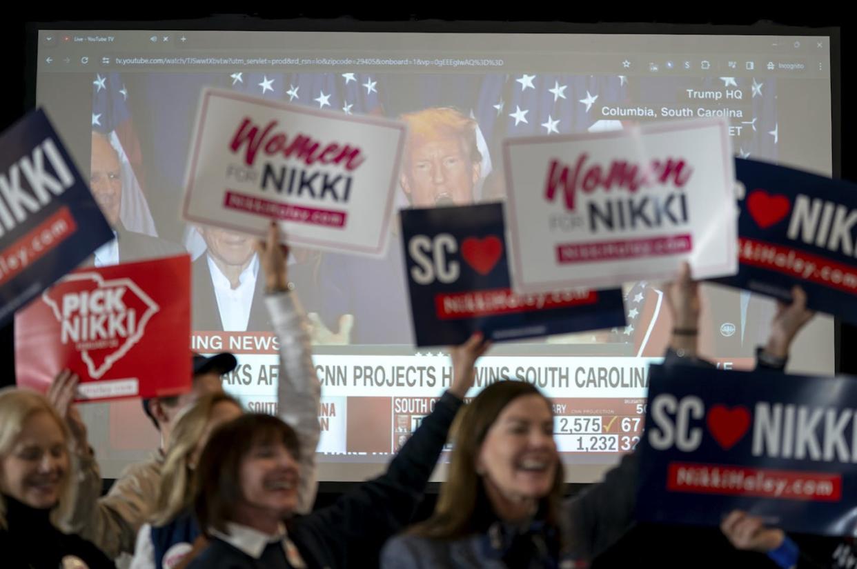 Supporters of GOP candidate Nikki Haley react as former President Donald Trump gives an acceptance speech during a primary election night party on Feb. 24, 2024, in Charleston, S.C. <a href="https://www.gettyimages.com/detail/news-photo/supporters-of-republican-presidential-candidate-former-u-n-news-photo/2028796747?adppopup=true" rel="nofollow noopener" target="_blank" data-ylk="slk:Sean Rayford/Getty Images;elm:context_link;itc:0;sec:content-canvas" class="link ">Sean Rayford/Getty Images</a>