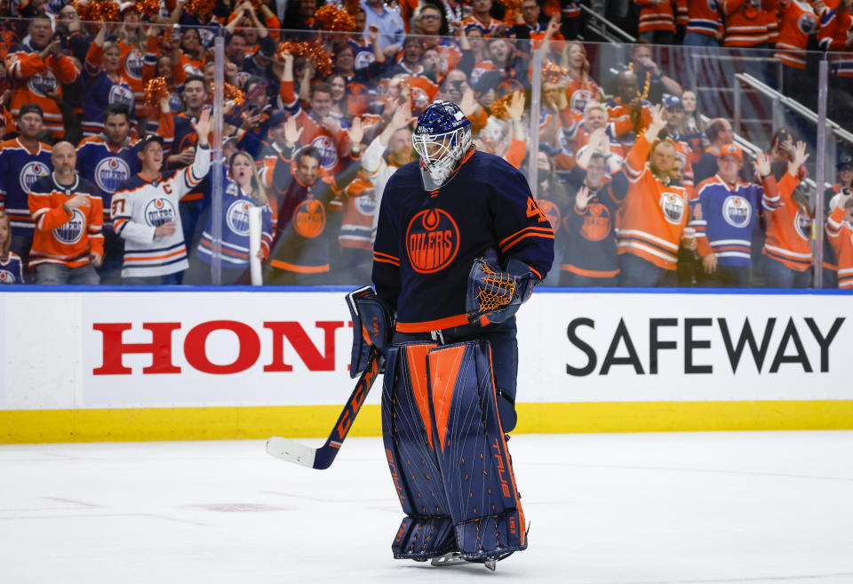 Edmonton Oilers goalie Mike Smith returns to the ice during third period NHL second round playoff hockey action against the Calgary Flames in Edmonton, Alberta, Sunday, May 22, 2022. (Jeff McIntosh/The Canadian Press via AP)