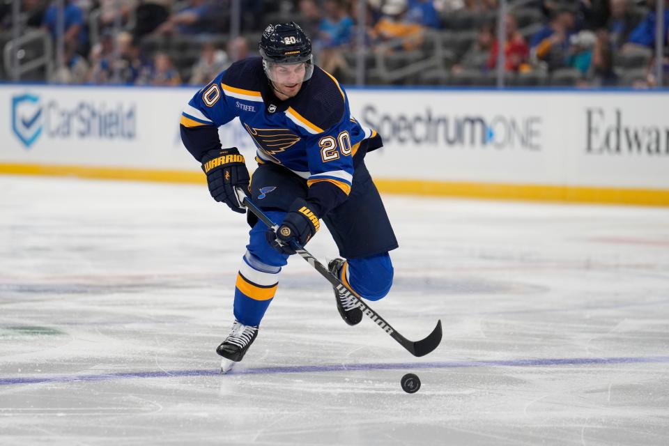 St. Louis Blues' Brandon Saad handles the puck during the second period of a preseason NHL hockey game against the Columbus Blue Jackets Tuesday, Sept. 26, 2023, in St. Louis. (AP Photo/Jeff Roberson)