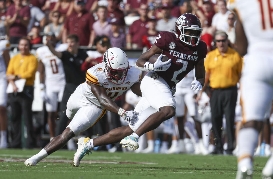 Sep 16, 2023; College Station, Texas; Louisiana Monroe Warhawks linebacker Travor Randle (4) attempts to tackle Texas A&M Aggies running back Rueben Owens (2) on a play during the second quarter at Kyle Field. Troy Taormina-USA TODAY Sports