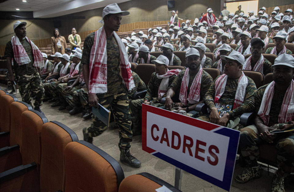 Cadres of different rebel groups sit during a surrender ceremony in Gauhati, India, Thursday, Jan. 23, 2020. More than 600 insurgents belonging to eight different rebel groups have surrendered to Indian authorities in this troubled northeastern state, responding to the government’s peace initiative to rejoin mainstream society. (AP Photo/Anupam Nath)