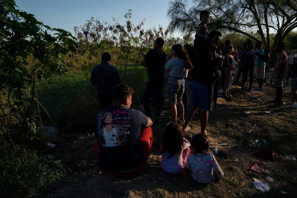 Migrants look across the Rio Grande, where there is law enforcement activity as they build a fence and receive asylum seekers, in Matamoros, Tamaulipas, Mexico, on Dec. 22, 2022.  / Credit: VERONICA G. CARDENAS/AFP via Getty Images