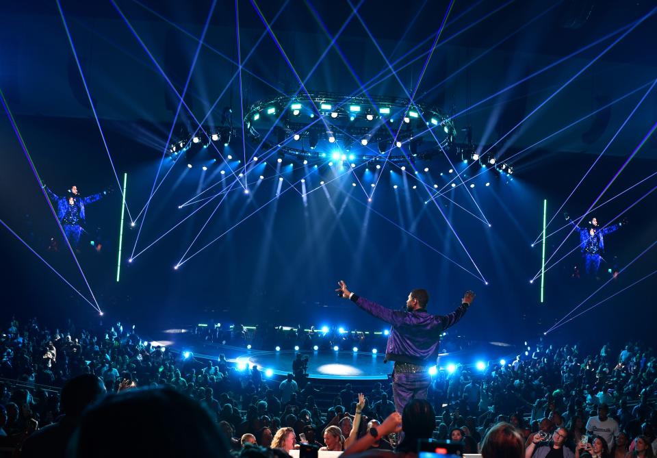 Usher mingles with fans during his Las Vegas residency at Park MGM, but also offers VIP packages with onstage seating.