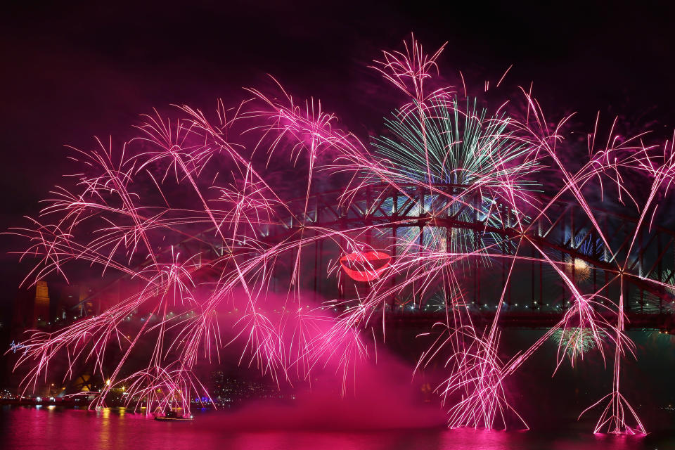 SYDNEY, AUSTRALIA - DECEMBER 31: Fireworks light up the sky from The Sydney Harbour Bridge at midnight during New Years Eve celebrations on Sydney Harbour on December 31, 2012 in Sydney, Australia. (Photo by Cameron Spencer/Getty Images)