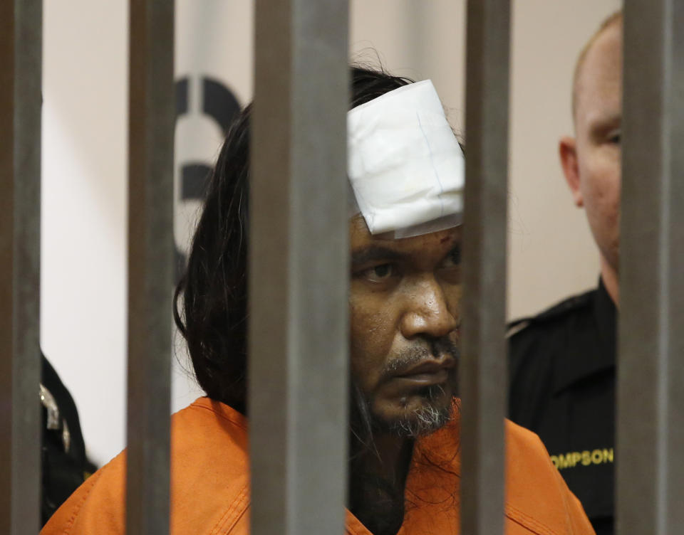 Adel Sambrano Ramos enters a Sacramento County Superior Court room for his first court appearance in the shooting death of Sacramento Police officer Tara O'Sullivan in Sacramento County Superior Court in Sacramento, Calif., Monday, June 24, 2019. Ramos did not enter a plea. A bandage covers Ramos' forehead after he was treated at an outside hospital after he smashed his head against a bed frame Sunday morning, according to officials. (AP Photo/Rich Pedroncelli)