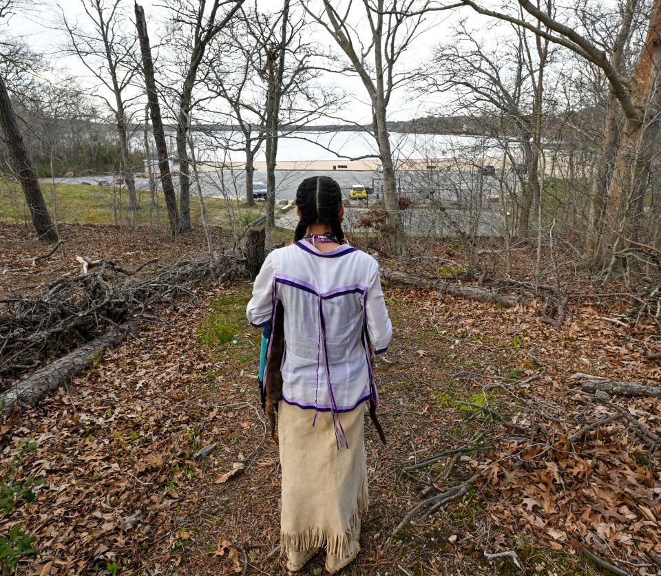 Mashpee Wampanoag Tribe member Madas Strickland looks toward Mashpee Wakeby Pond on Friday in Mashpee.