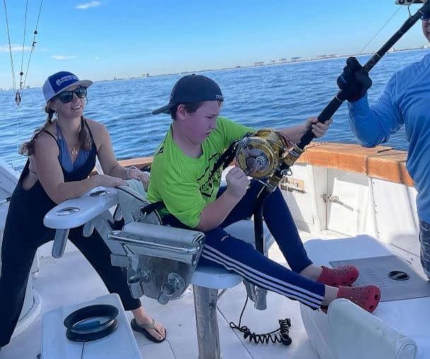 PHOTO: 12-year-old Cambell Keenan reels in a great white shark while fishing in Florida. (Courtesy of Katie Savage)