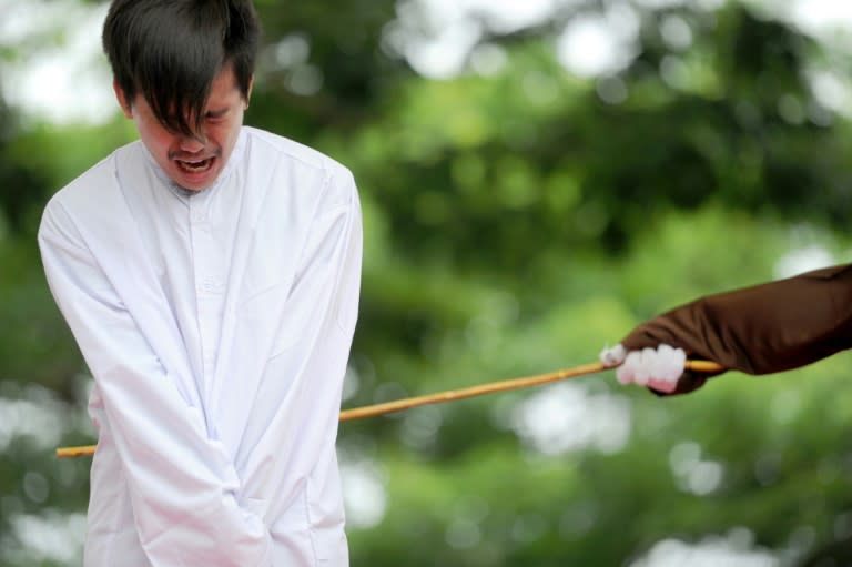 The two men received 83 strokes of the cane each after being found guilty of breaking sharia rules in conservative Aceh province