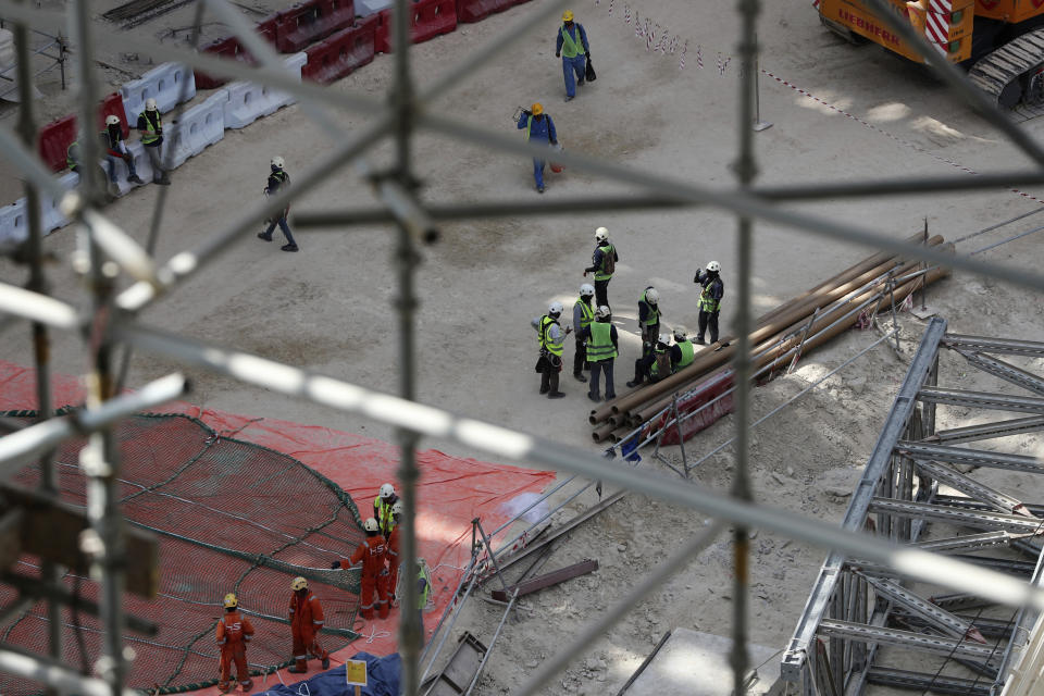 In this Oct. 8, 2019 photo, laborers work under the Al Wasl Dome at the under construction site of the Expo 2020 in Dubai, United Arab Emirates. The preparations for Expo 2020 come as Dubai’s real estate market show signs of faltering amid global economic woes. Fears of military conflict across the Persian Gulf cloud organizers’ sunny projections. (AP Photo/Kamran Jebreili)